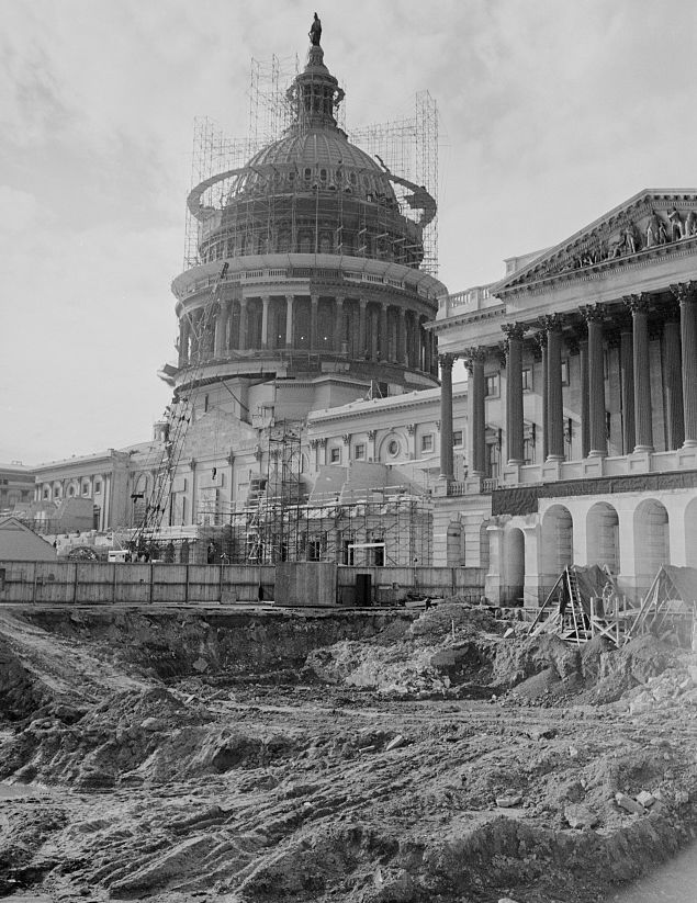 Black and white historic photo of construction work outside the U.S. Capitol.